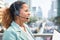 African American woman wears headphones as operators to report or answer traffic problems