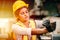 African American woman worker with safety suit helmet working in heavy metal industry factory hardworking women