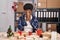 African american woman working at small business doing christmas decoration with sad expression covering face with hands while