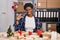 African american woman working at small business doing christmas decoration smiling and confident gesturing with hand doing small