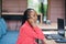 African american woman works in a call center operator and customer service agent wearing microphone headsets working on laptop