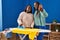 African american women ironing clothes make selfie by smartphone at laundry room