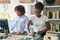 African american women shop assistants working at clothing store