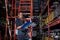 African american worker woman wear spectacles crossed arms holding clipboard standing in factory auto parts.