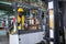 African American workers drive forklifts and wearing safety helmets and vests in the automotive parts warehouse. Transportation,
