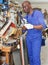 African-American workman looking at glass samples