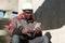 African american workman with smartphone at construction site