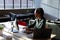 African american young businesswoman using computer at desk in office