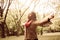 African American young woman dancing in park alone.