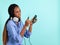 African American young woman with retro wired head phones.