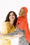 African and Asian women together on white background