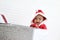 African baby kid in Santa Claus costume hold ball ornament near big white gift box present, beautiful little child celebrates