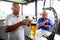 African Barman pouring a pint draft beer at barman training school