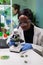 African biologist researcher analyzing gmo green leaf