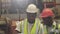 African black engineer staff foreman training talk job process explain to new staff worker.
