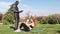 African black man and redhead caucasian woman exercising, doing sit-ups in a park with a mat