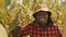 African black man showing thumb up in the corn field