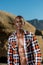 African black model with six pack in unbuttoned checkered shirt