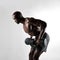 African bodybuilder exercising with dumbbells