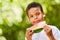 African boy is eating a juicy watermelon