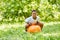 African boy is sitting on a bouncing ball