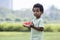 African boy with watermelon on hand