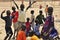 African boys playing football on the beach