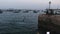 African Boys Teenagers Jump into the Water from High Embankment in Stone Town