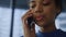 African business woman answering call on smartphone. Closeup surprised woman