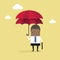 African businessman with double umbrella, Business Concept.