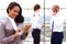 African businesswoman businessman holding a tablet in hand standing outdoor