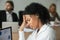 African businesswoman feeling unwell suffering from headache at