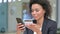African Businesswoman Shopping Online on Smartphonee