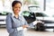 African car saleswoman presenting