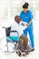 African caregiver helping senior