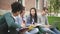 African. caucasian and asian university students doing homework together.