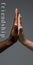 African and caucasian hands gesturing on gray studio background, tolerance and equality concept