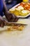 African chef  cutting onion