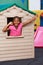 African child cheering in playhouse