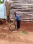 AFRICAN CHILD IN KAPCHORWA EASTERN UGANDA PLAYS WITH A TYRE.