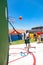 African children making a goal shot on public playground basketball court