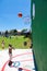 African children making a goal shot on public playground basketball court