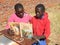 African children reading a Bible stories book