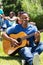 African college student playing guitar