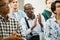 African conference participant applauding for speaker