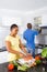 African couple preparing food