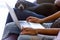 African couple resting on couch with dachshund using computer