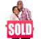 african couple sold sign