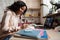 African cute smiling teen girl with laptop studying