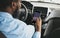 African Driver Using Smartphone With Car Navigation App Driving Auto